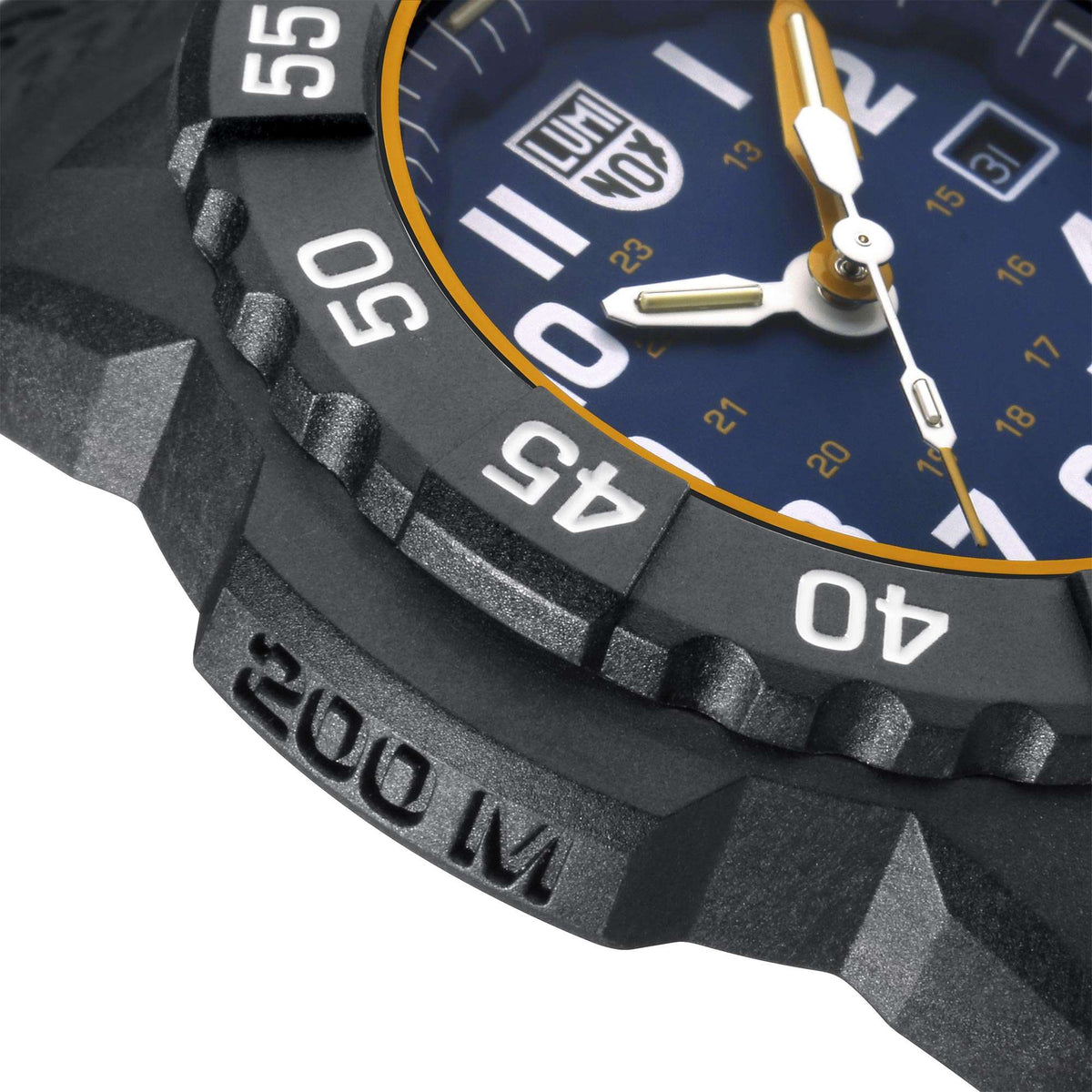 Close-up of blue dial with gold hands, black bezel with white numbers, and date window