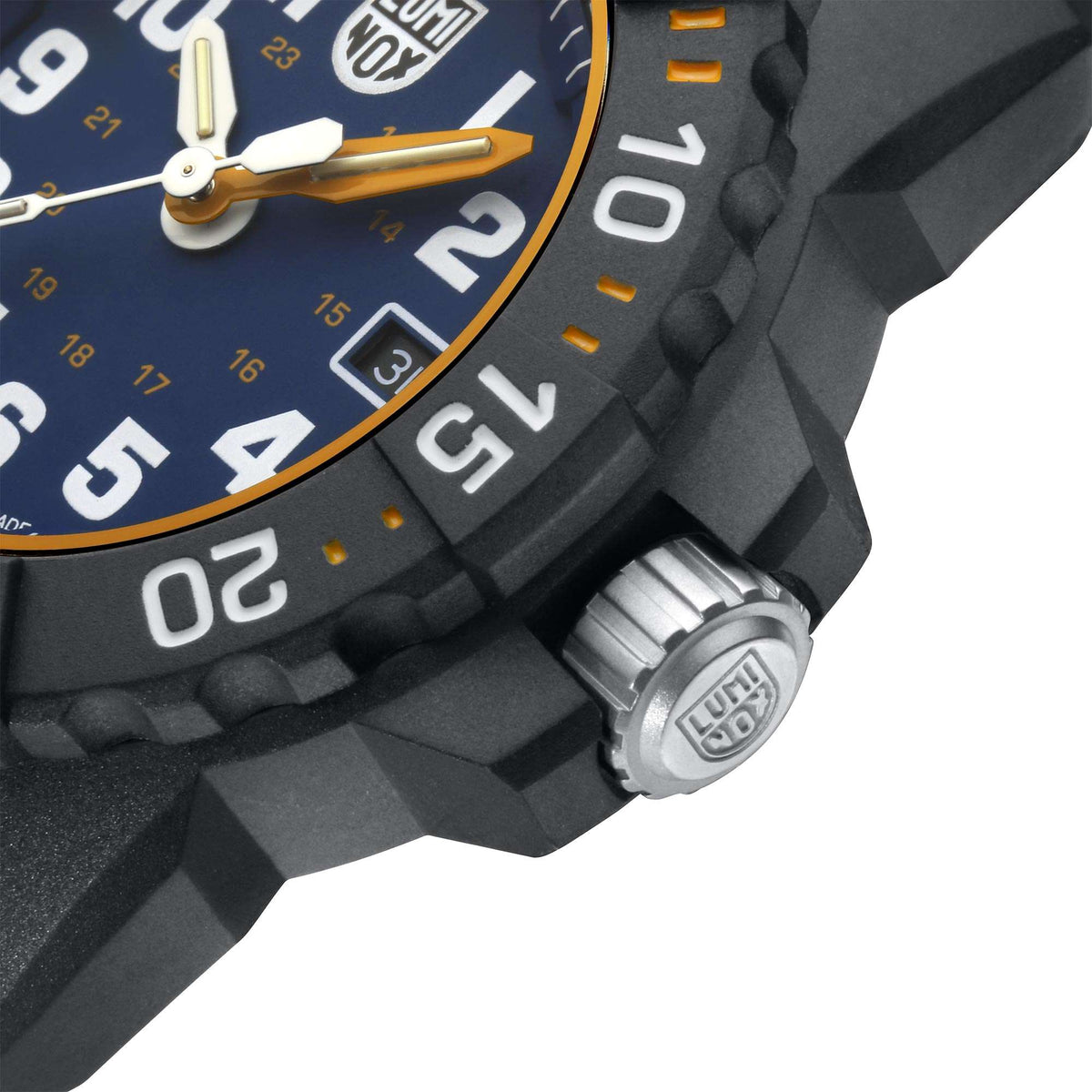 Side view of black bezel and gold hands, with crown detail and date window on blue dial