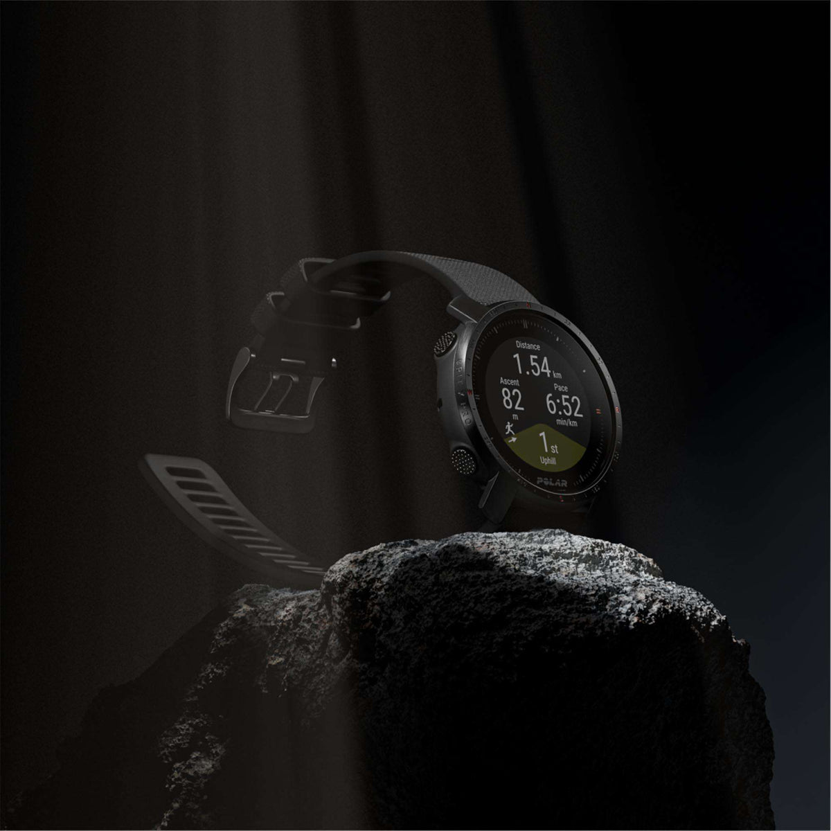 Black rugged sport watch with rubber strap and smartwatch display, angled view