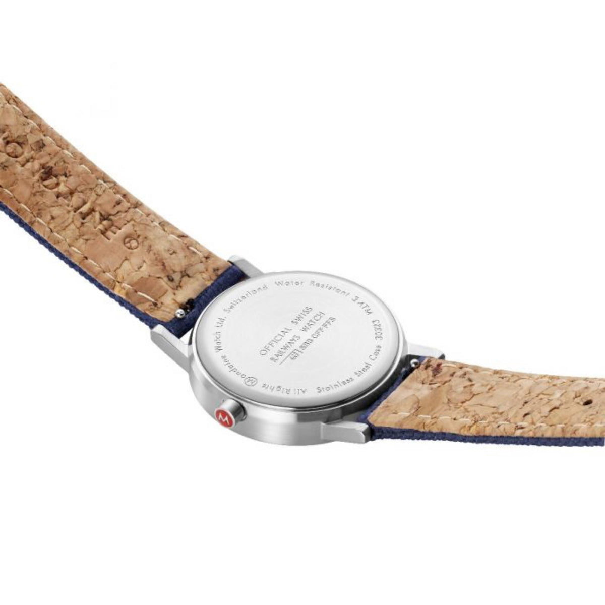 Quartz watch case back on tan leather strap, engraved dial underside