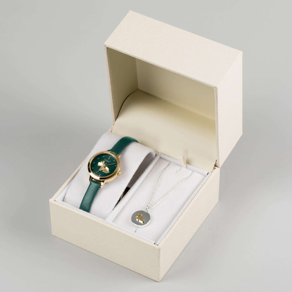 Watch and necklace set in open gift box with teal leather watch and silver pendant chain