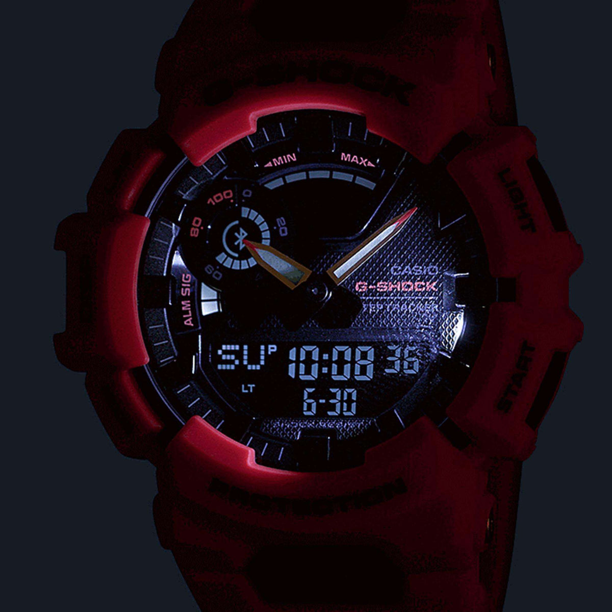 Casio G-Shock men’s quartz watch with illuminated black dial and red resin case