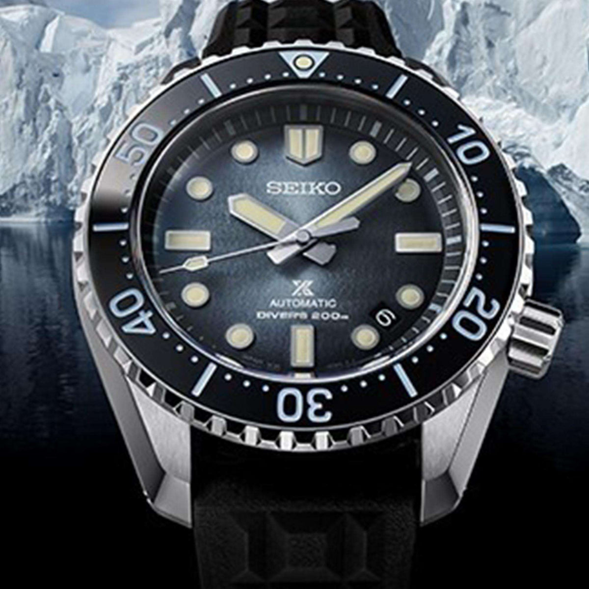 Men's Seiko dive watch with dark blue dial, black bezel, and black rubber strap