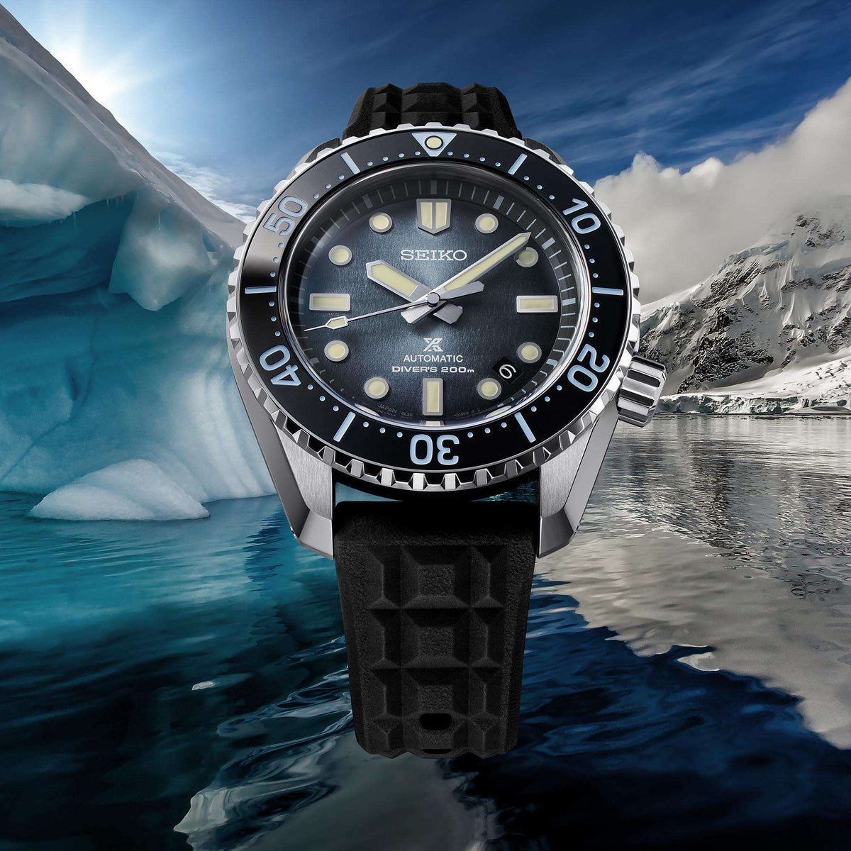 Men's Seiko diver watch with blue dial, black bezel, and black rubber strap