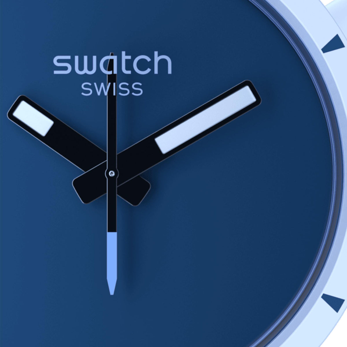 Close-up blue watch dial with silver hour markers, black hands, and logo