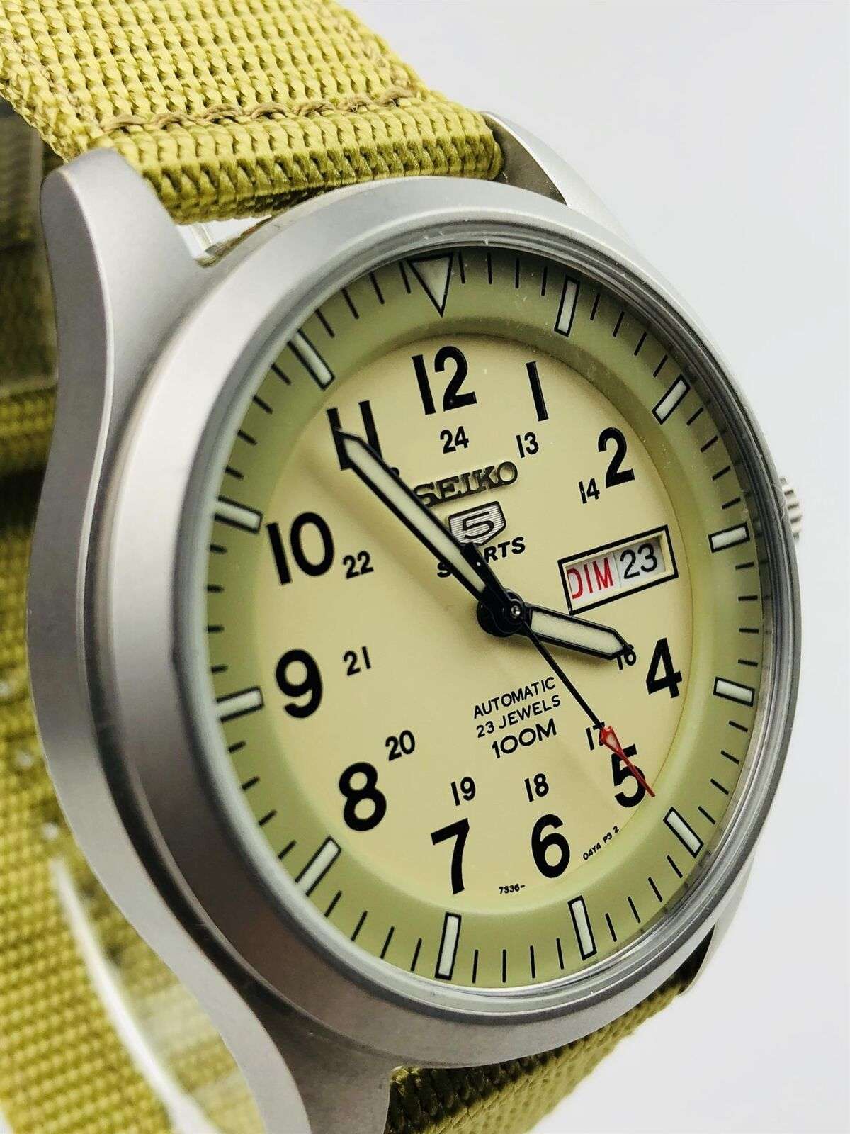 Seiko 5 Sports automatic watch with cream dial and green canvas fabric strap