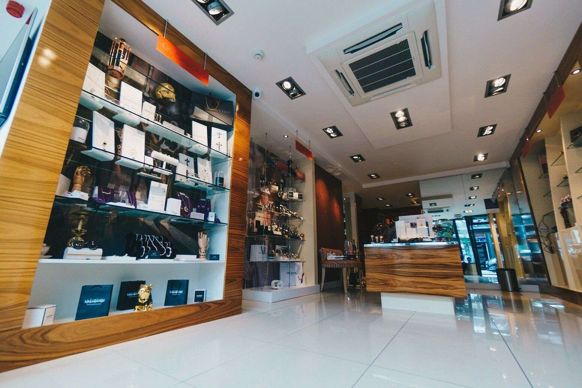 Watch shop interior display with shelves and lighting in a retail showroom