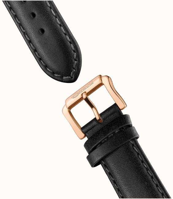 Black leather watch strap with rose-gold buckle clasp and punched stitching