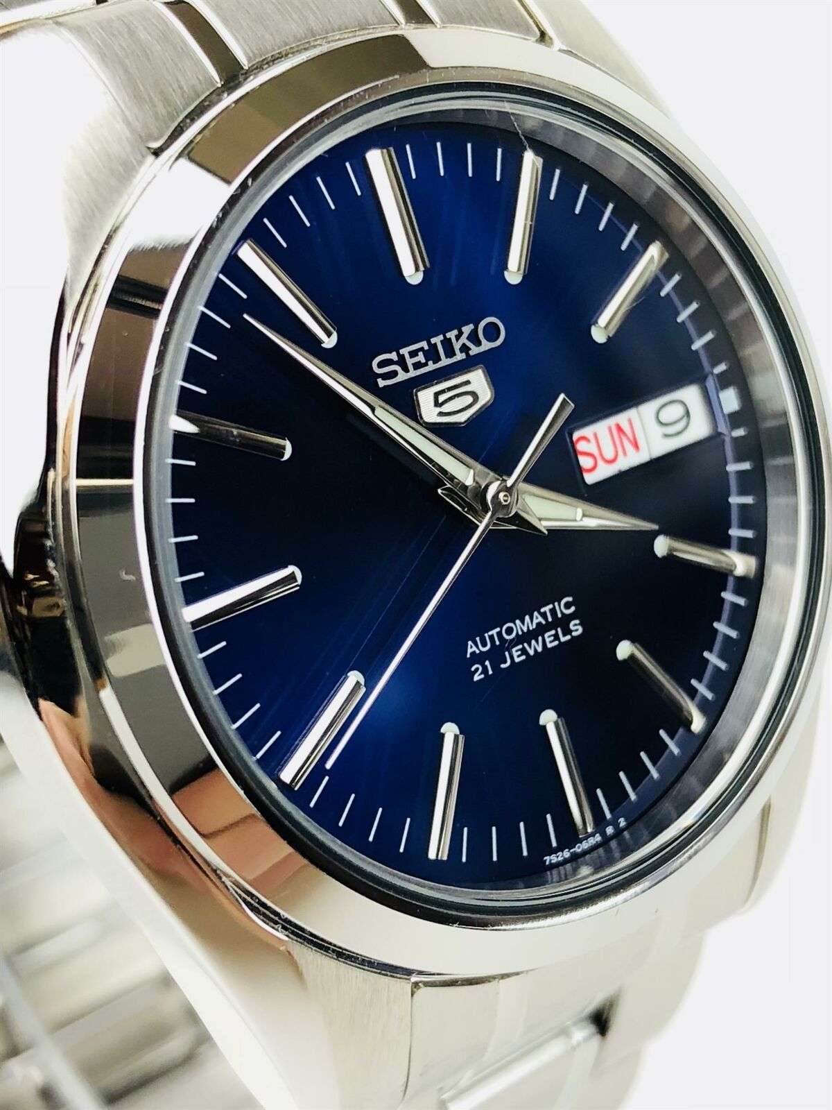 Angled view of Seiko SNKL43K1 blue dial automatic watch with stainless steel bracelet