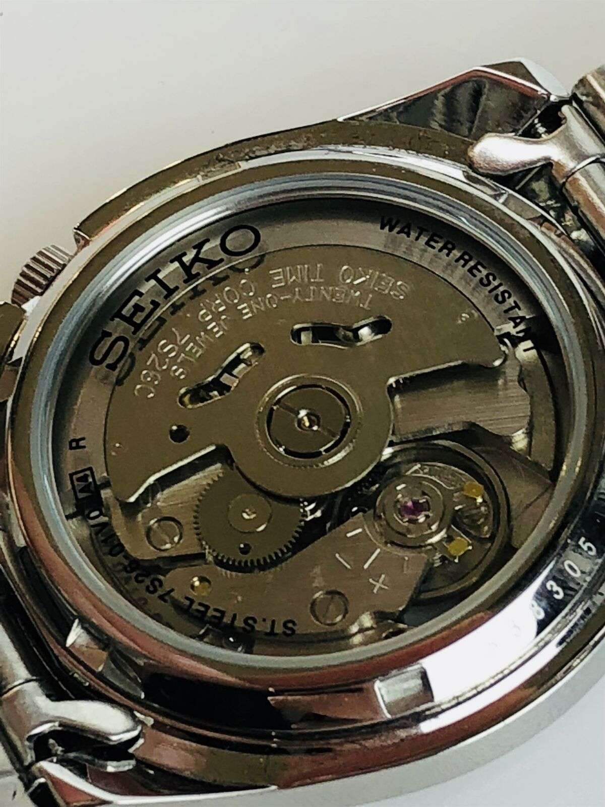 Seiko SNKL43K1 exhibition caseback showing automatic movement with 21 jewels