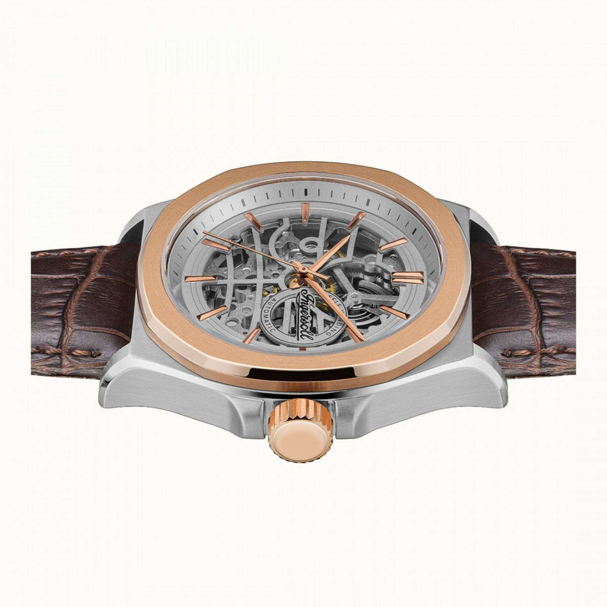 Automatic skeleton watch angled view, grey dial, rose-gold bezel, brown leather strap