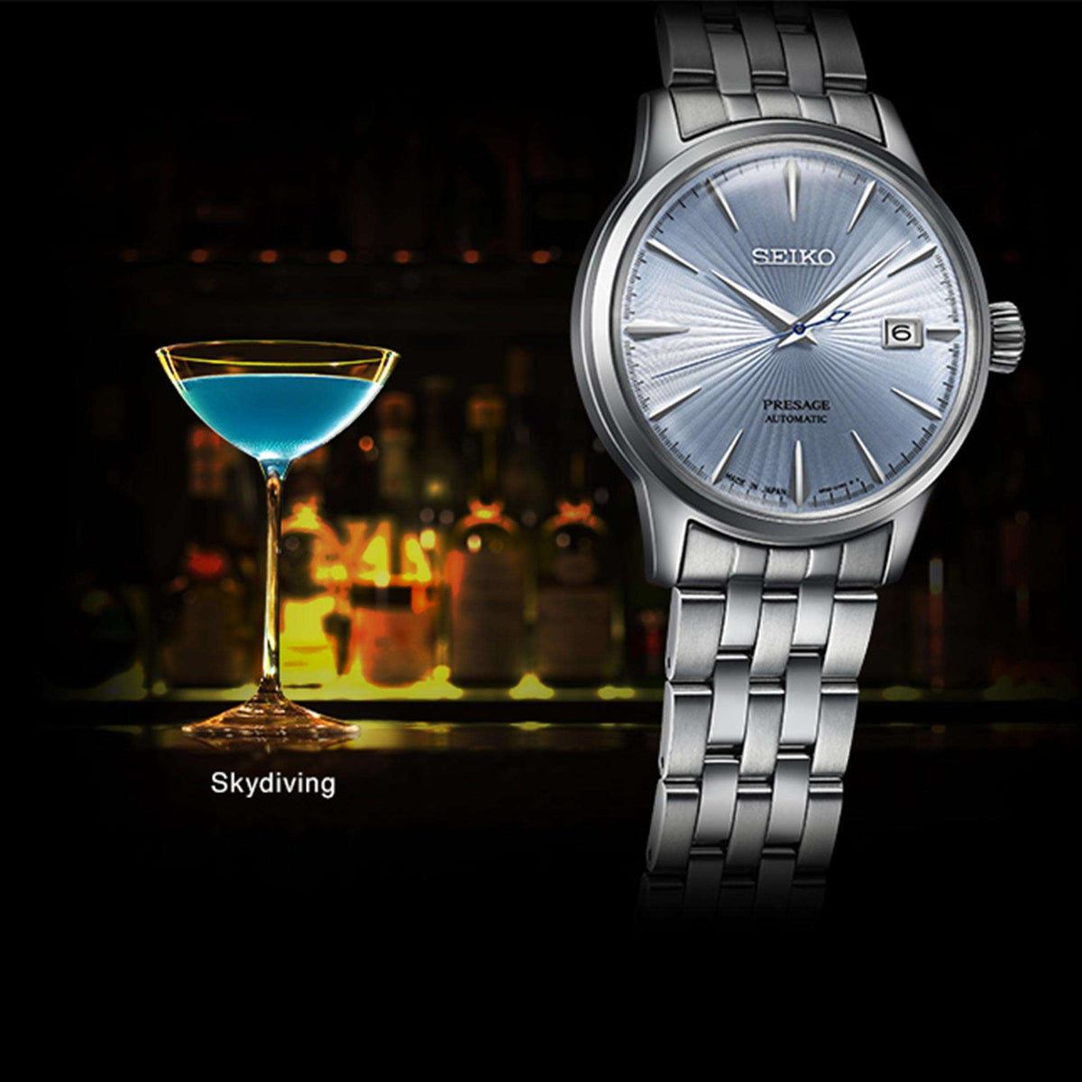 Silver stainless steel automatic watch with light blue sunburst dial and date window