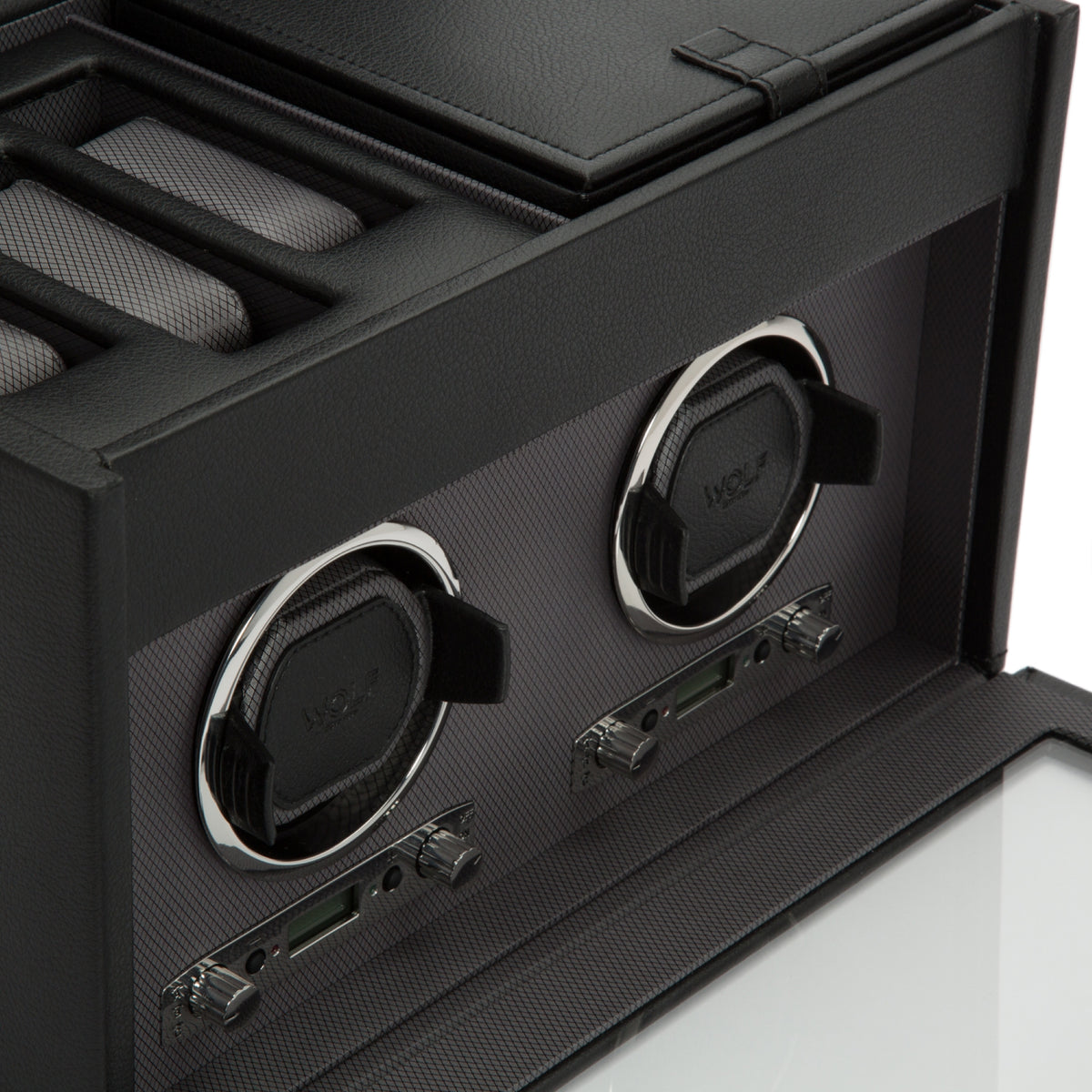 Close-up of black double watch winder interior with two cradles and control switches