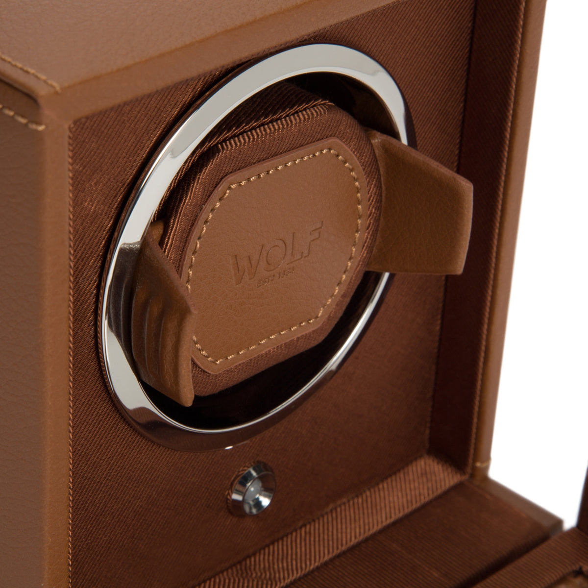 Close-up of cognac brown watch cradle inside vegan leather single watch winder window