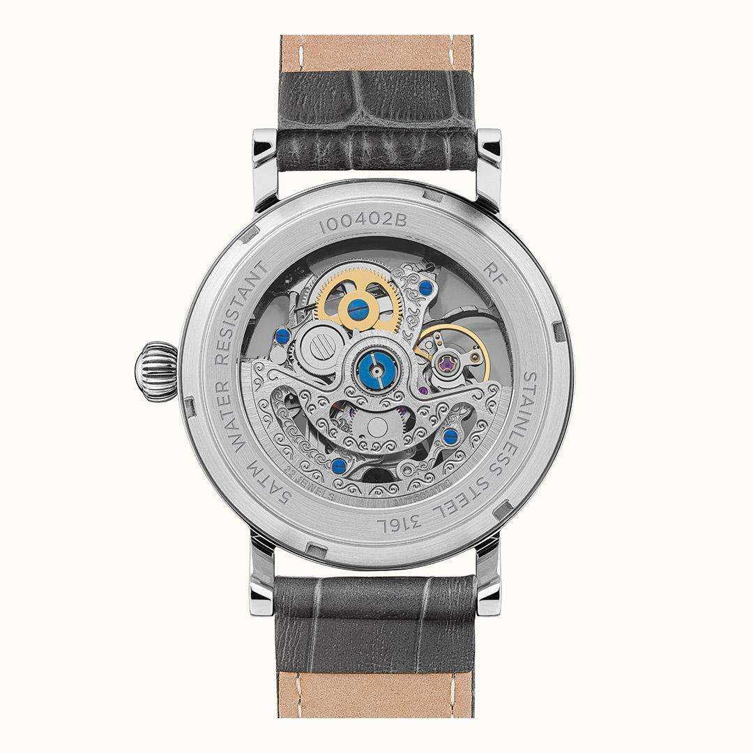Transparent caseback watch with grey leather strap, detailed movement and silver markings