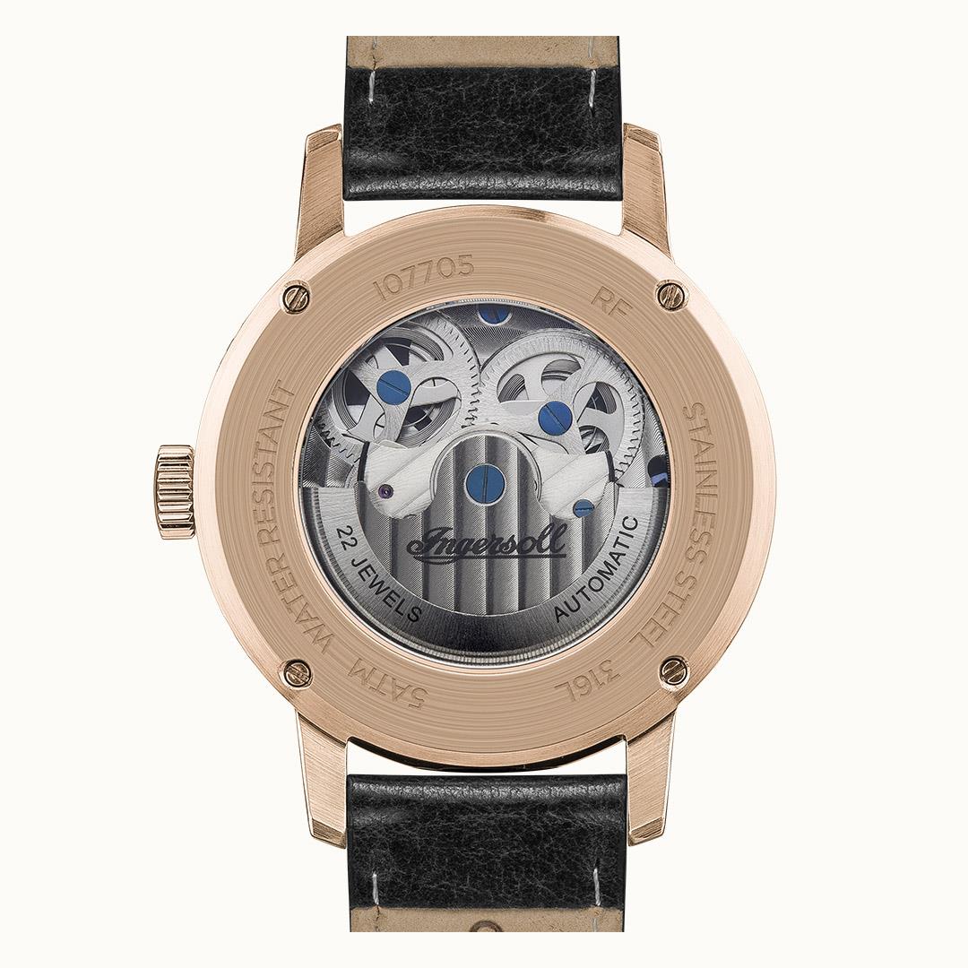 Men's automatic watch caseback with transparent dial and engraved details, black leather strap