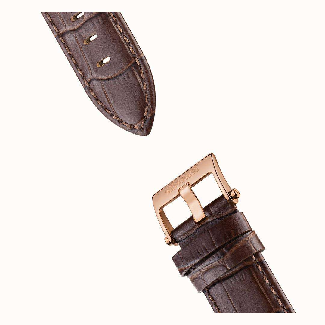 Brown leather watch strap with stitched edges and adjustable buckle