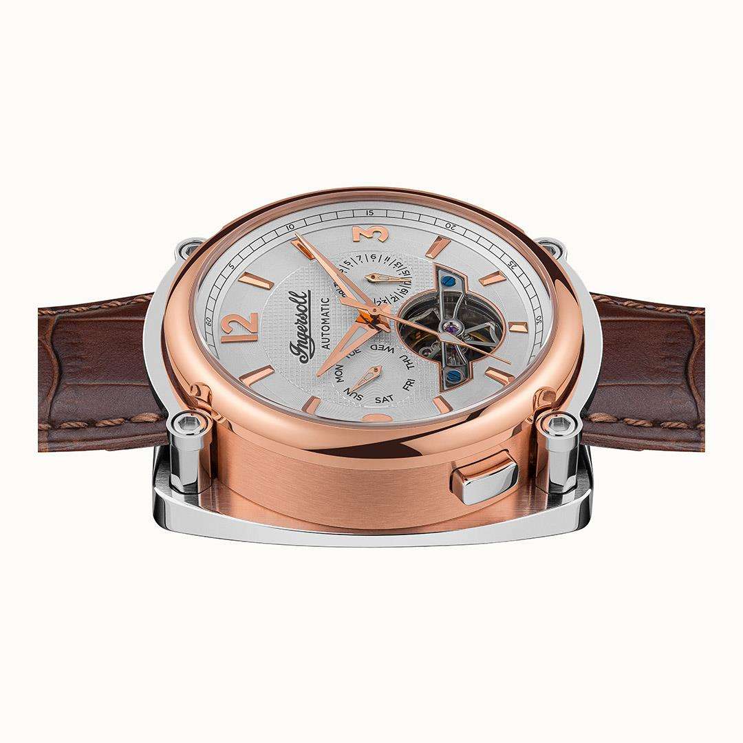 Men's automatic watch angled view with white dial, skeleton details, and brown leather strap