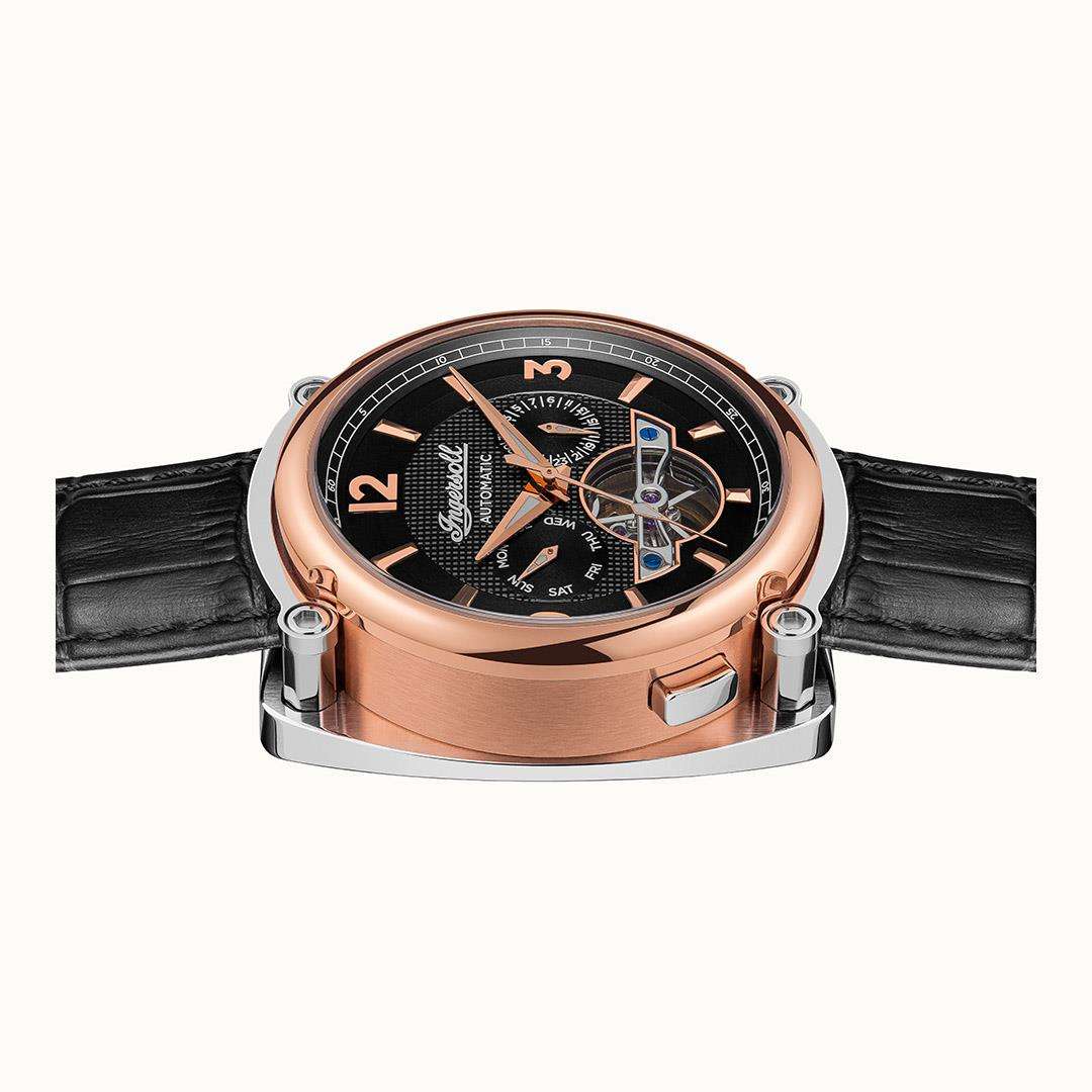 Men's automatic wristwatch front view with black dial, rose-gold case, and black leather strap.