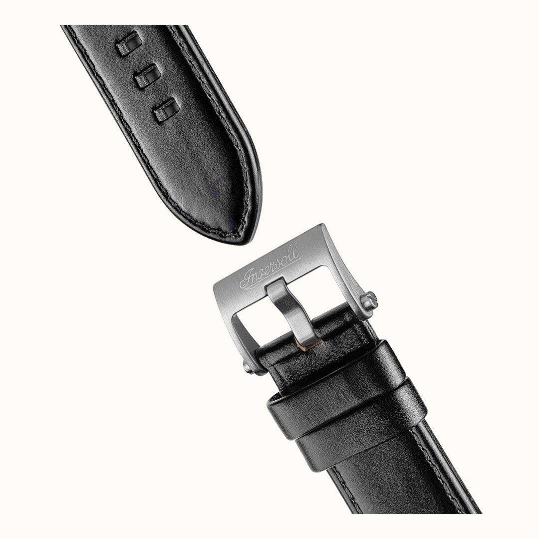 Black leather watch strap with metal buckle and top keeper, stitched edges