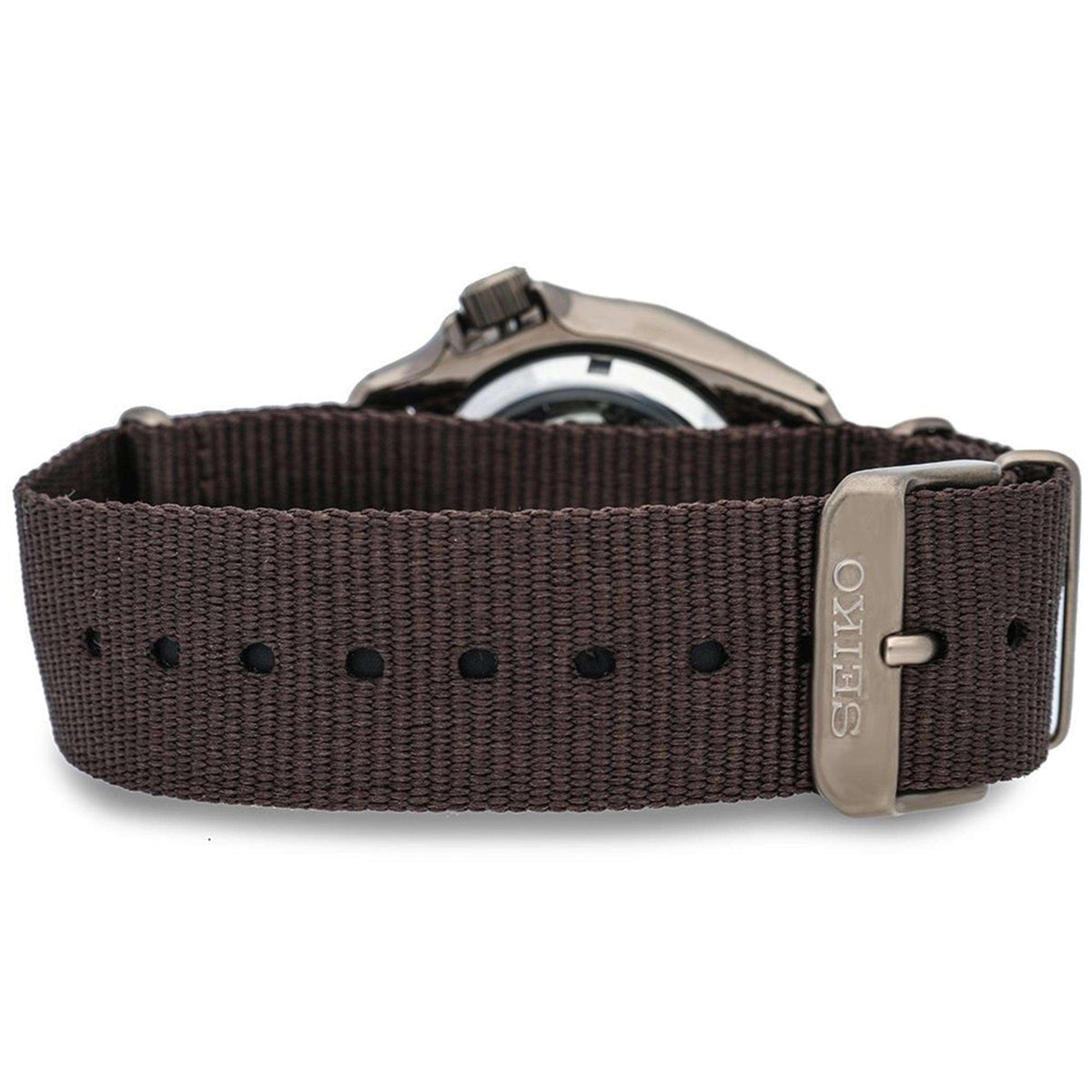 Seiko 5 Sports watch strap view: brown canvas band with metal buckle and stitched strap holes