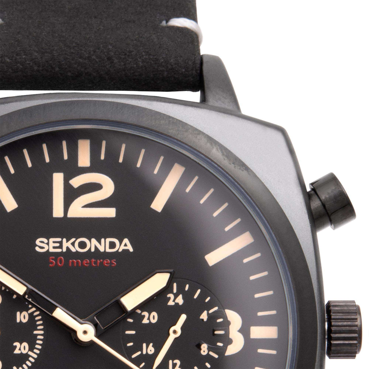 Close-up of black dial with large '12', gold-tone hands, subdial, and crown