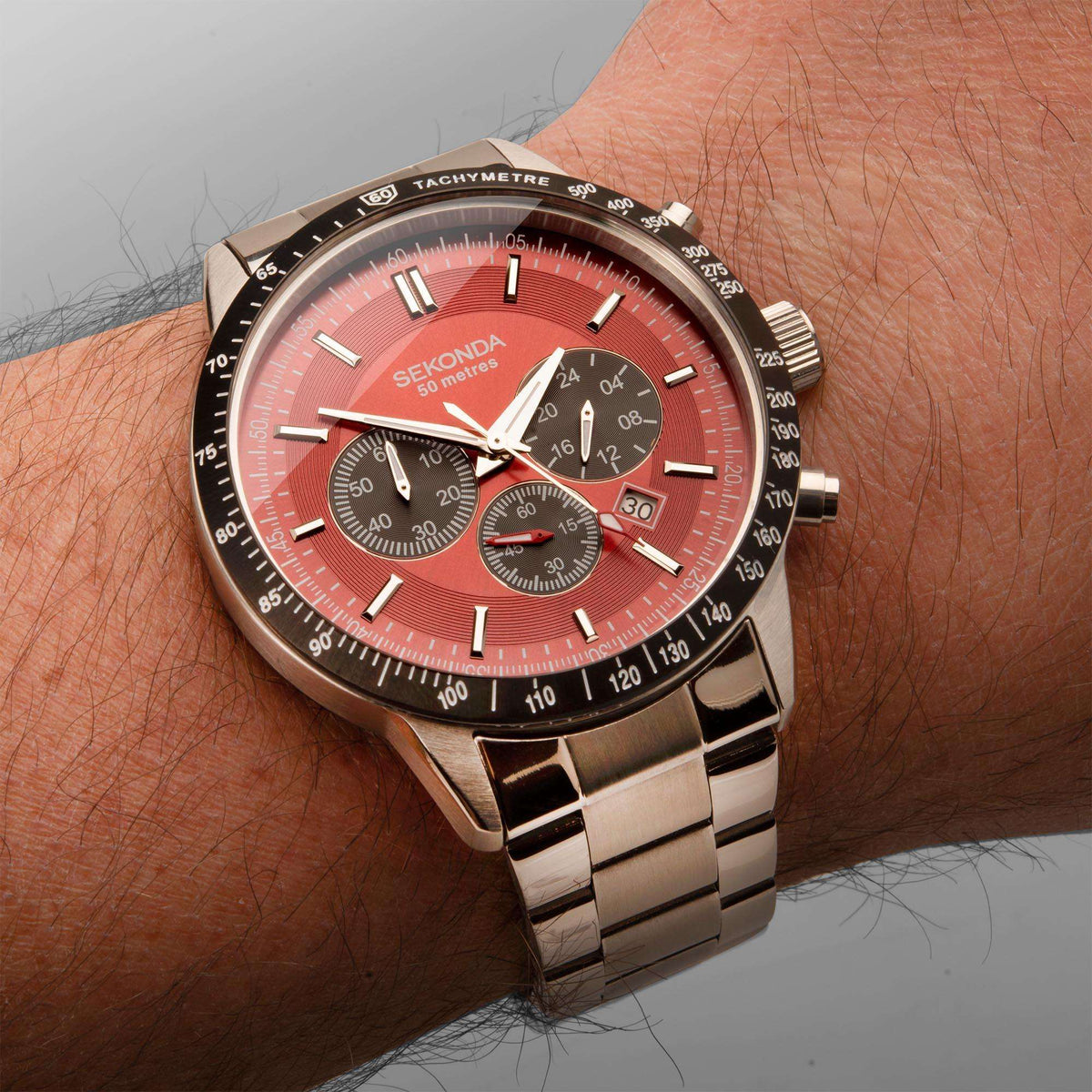 Men's stainless steel chronograph watch with red dial, subdials, tachymetre bezel