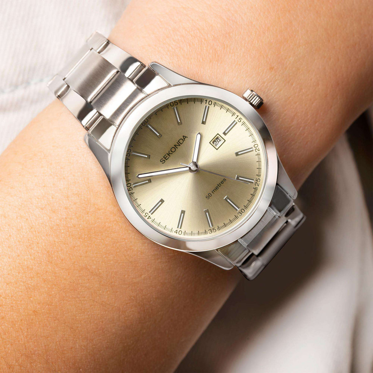 Sekonda ladies stainless steel bracelet watch on wrist with beige dial and date