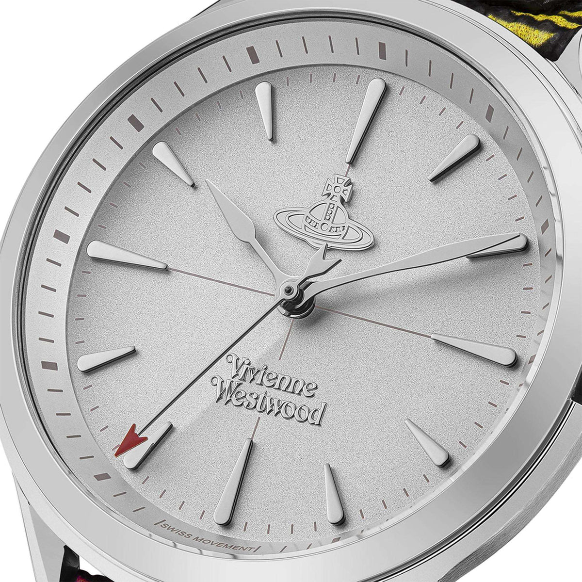 Close-up of silver watch dial with logo hands and hour markers