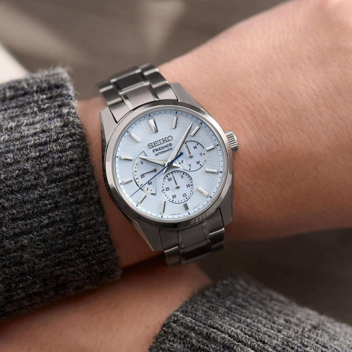 Seiko Presage men's automatic watch on wrist, blue dial with subdials and steel band