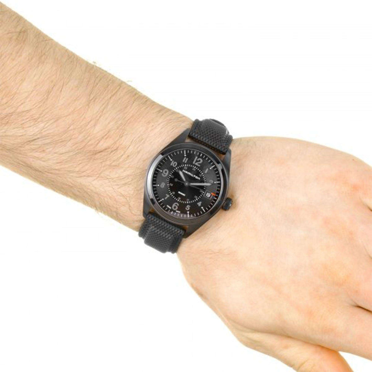 Men's black dial quartz wristwatch with textured black strap and carbon fiber case