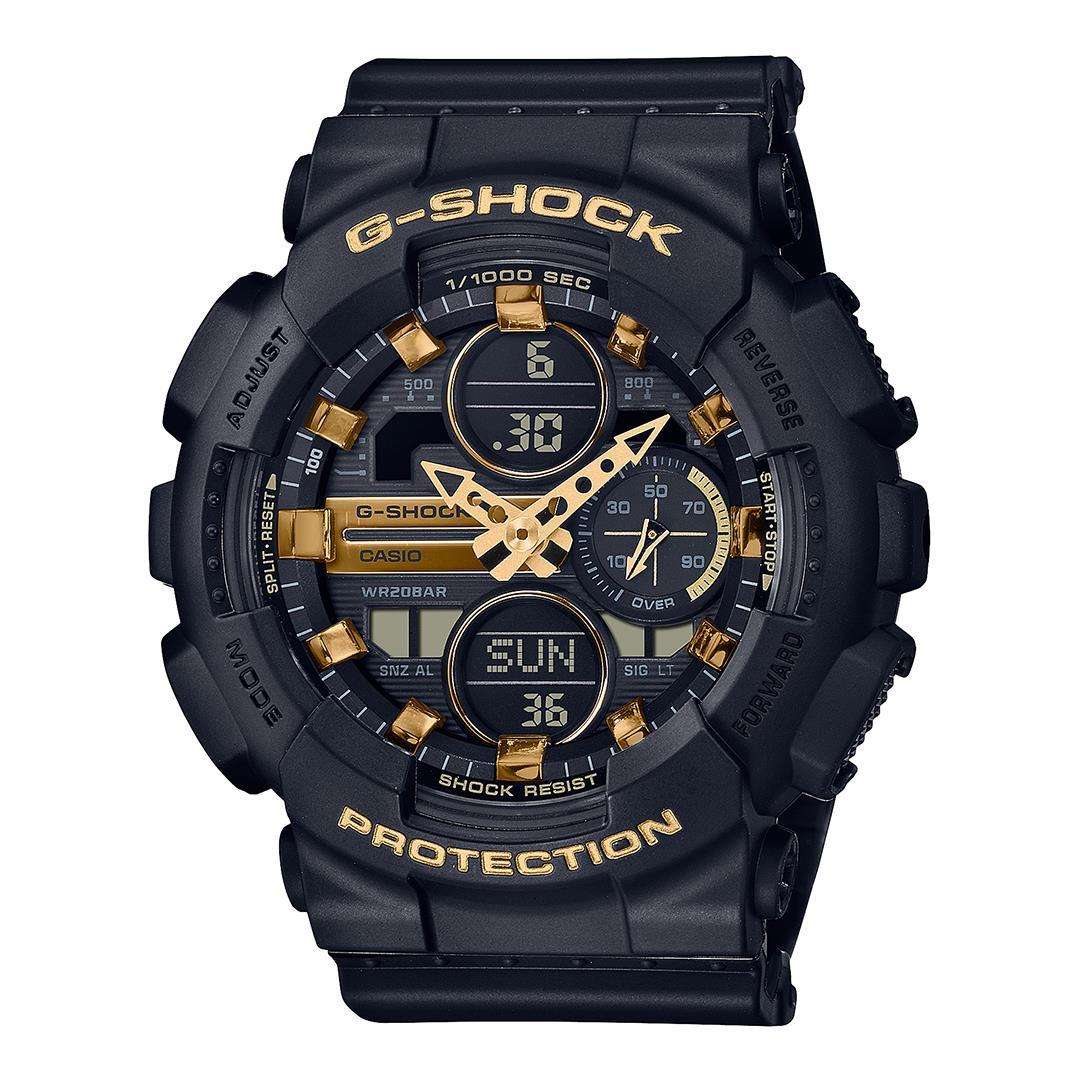 Black sports watch with black dial, gold accents, and black silicone strap.