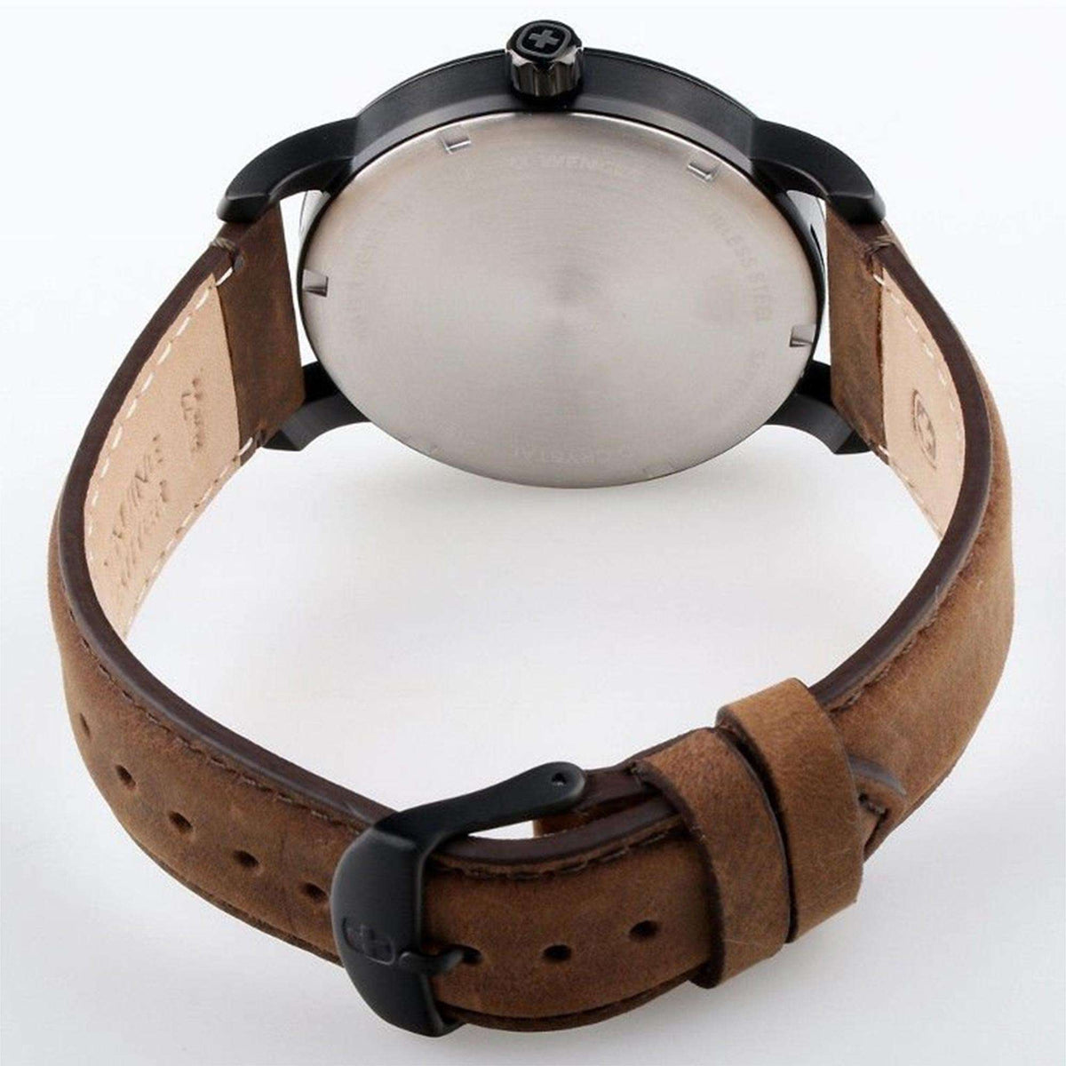 Men's watch back with brown leather strap and black buckle on dark case.