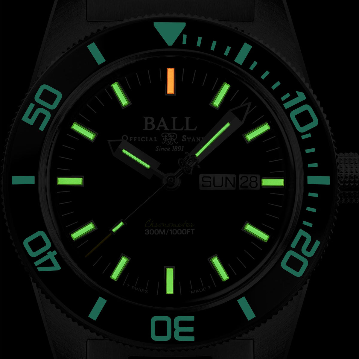 Men's automatic diver watch with black dial, green markers, steel bezel, date window