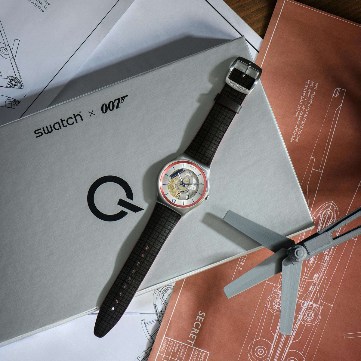 Quartz skeleton watch with dark leather strap and silver case in presentation box