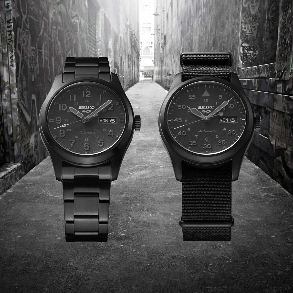 Two black dial field watches with nylon straps, round cases and day-date windows