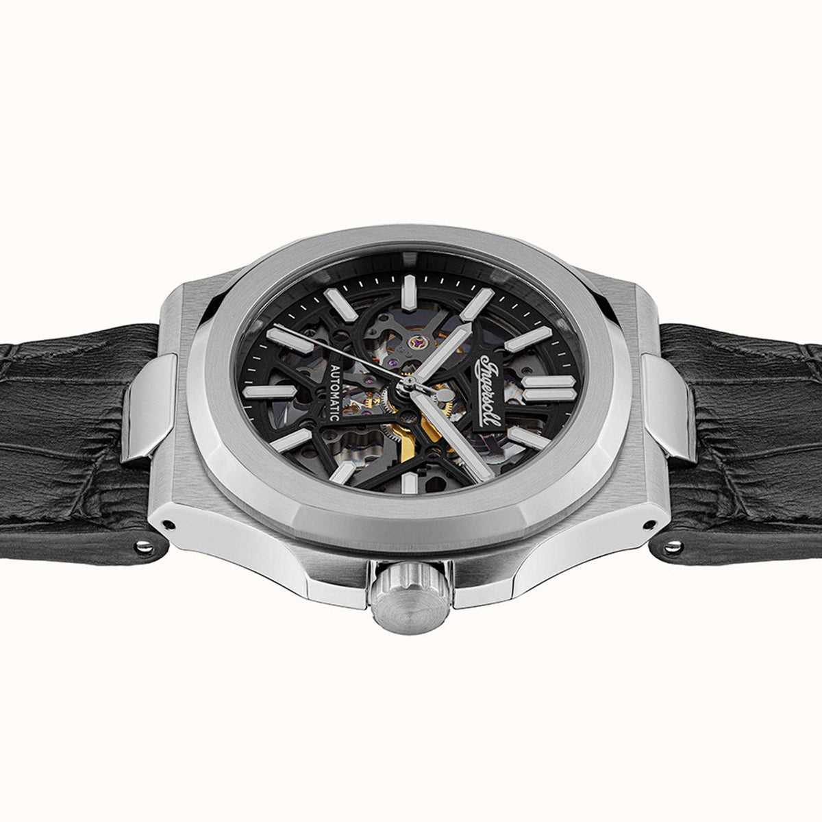 Men's automatic skeleton watch front view on black leather strap with silver bezel and crown