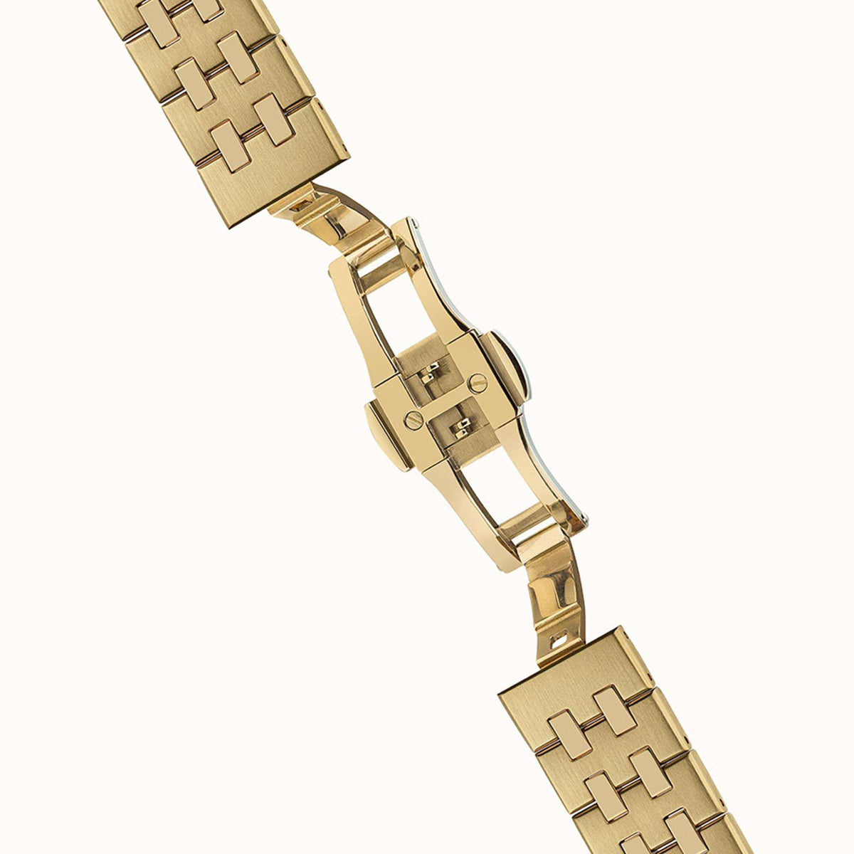 Gold-tone stainless steel link bracelet section with folding clasp and end links visible