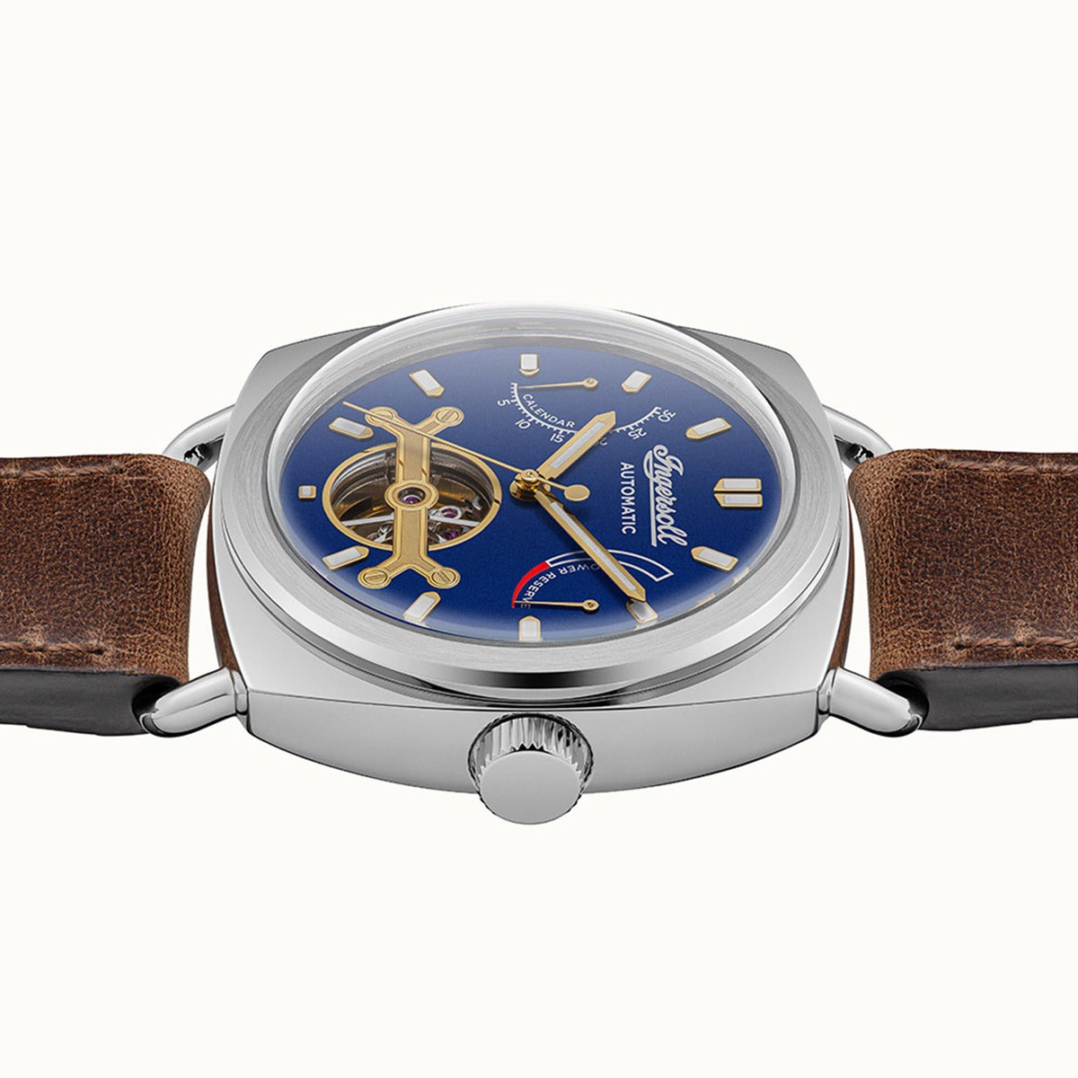 Automatic men's watch with blue dial, brown leather strap, and round steel case