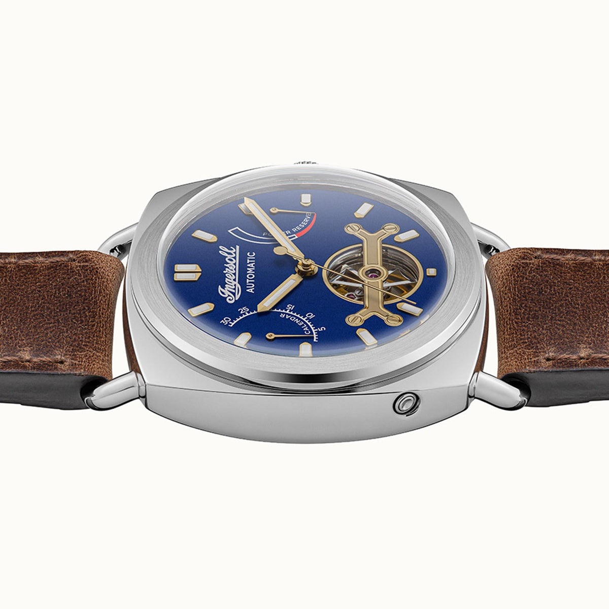 Automatic men's watch front with blue dial, gold hands, brown leather strap, steel case
