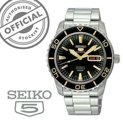 Men's stainless steel automatic watch front view with black dial and gold accents, SEIKO 5 badge