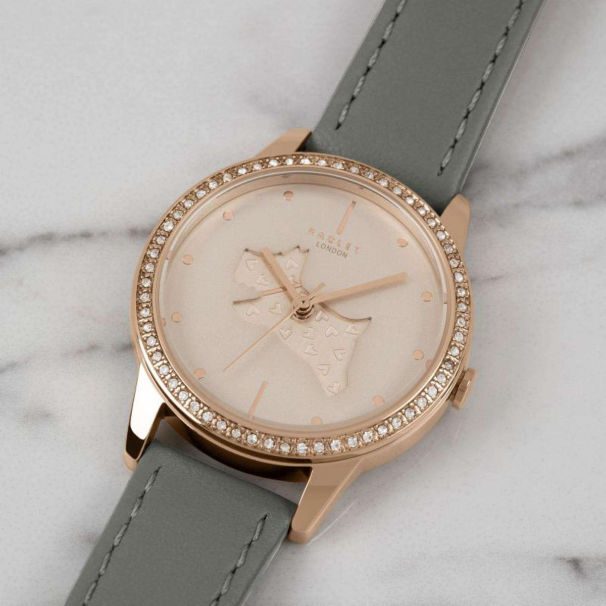 Rose-gold tone quartz watch with horse motif dial, grey leather strap and crystal bezel