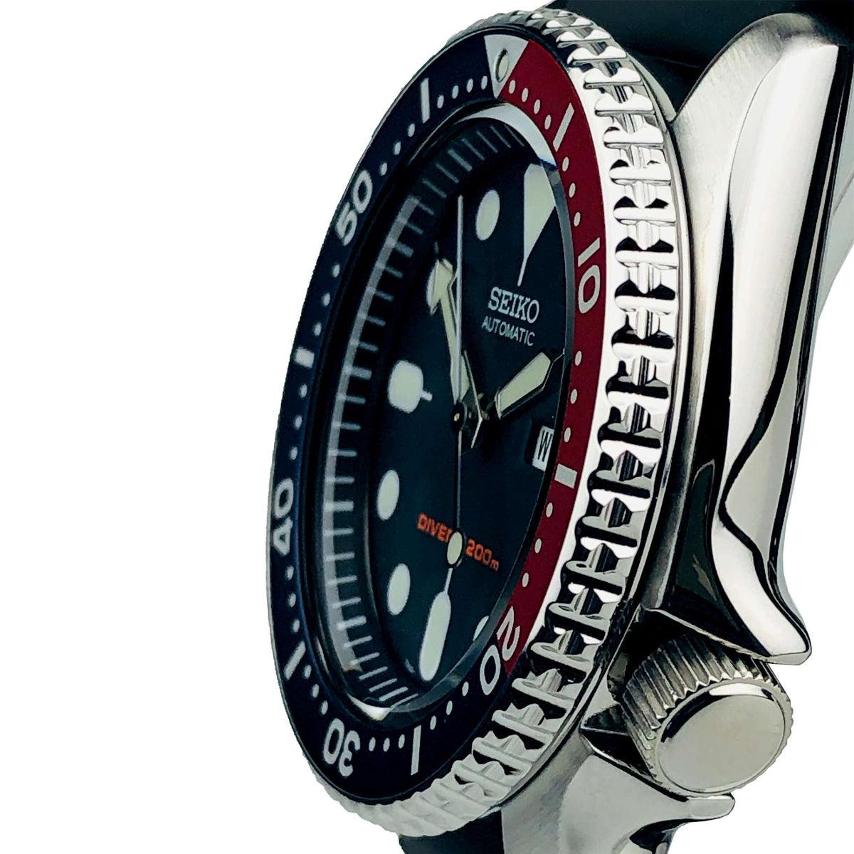 Seiko diver watch angled side view with crown, brushed steel case, dark blue dial