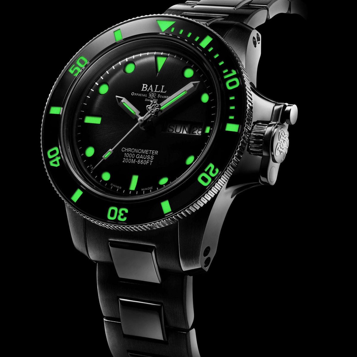 Men's stainless steel watch, black dial with green markers, crown and bracelet