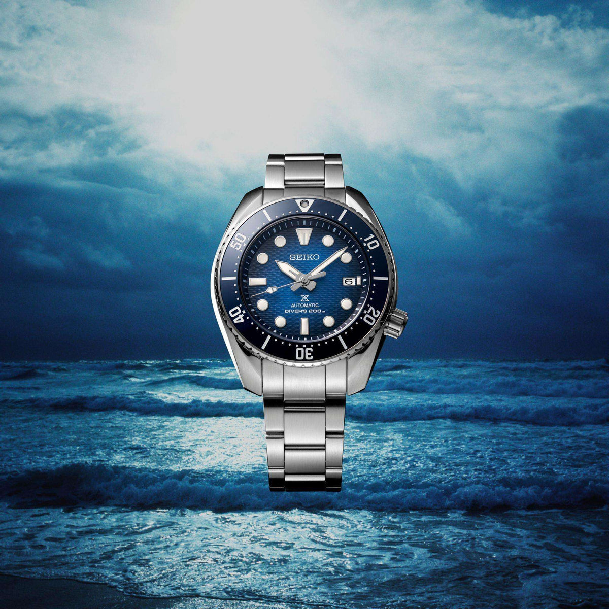 Seiko men's automatic divers watch with blue dial, steel bracelet, and bezel detail