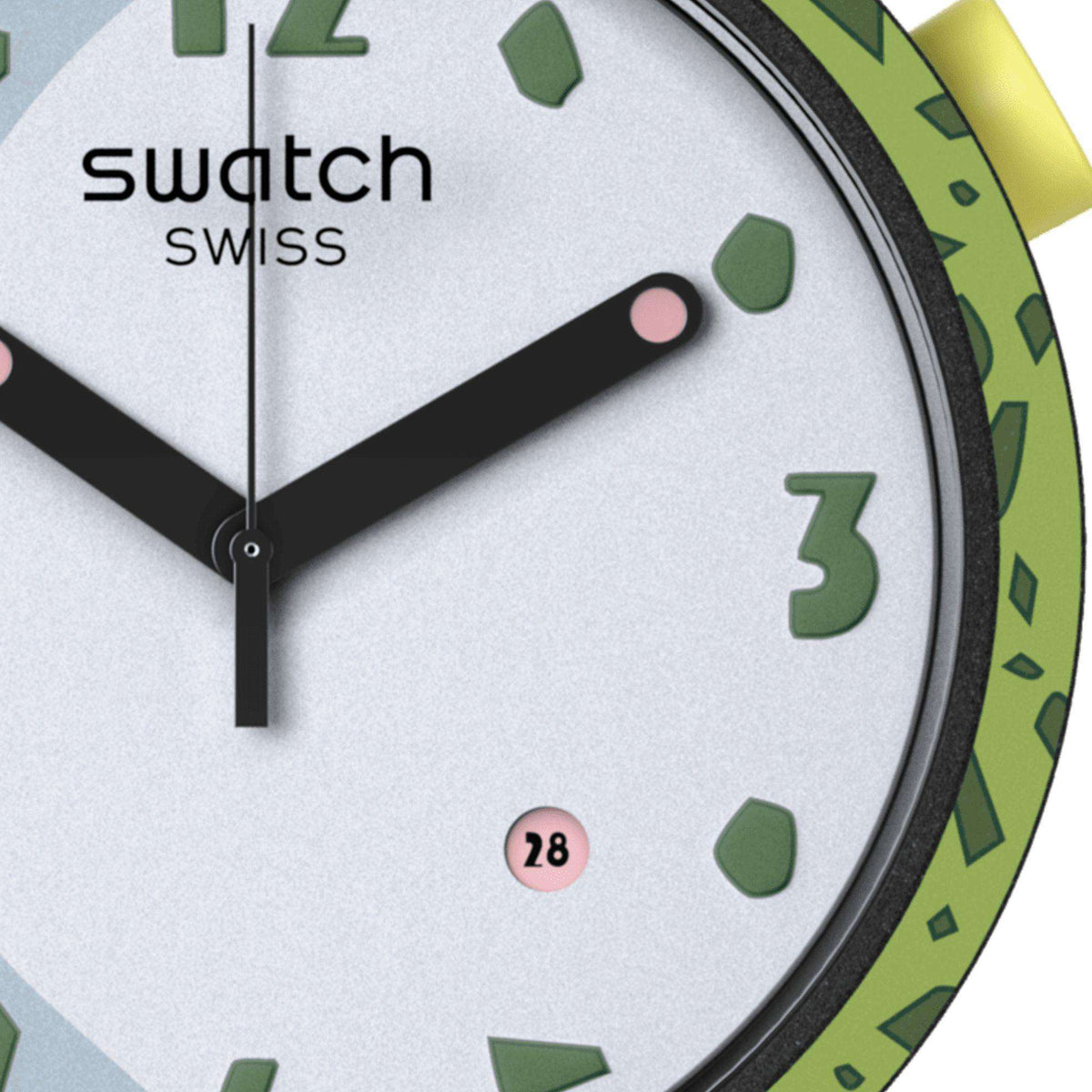 White watch dial close-up with black hands, green markers, date 28, Swatch Swiss text