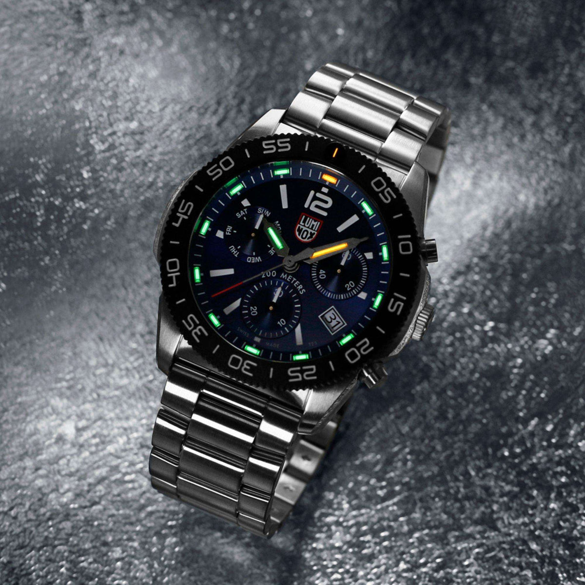 Stainless steel diver watch with black dial, luminous markers, and subdials