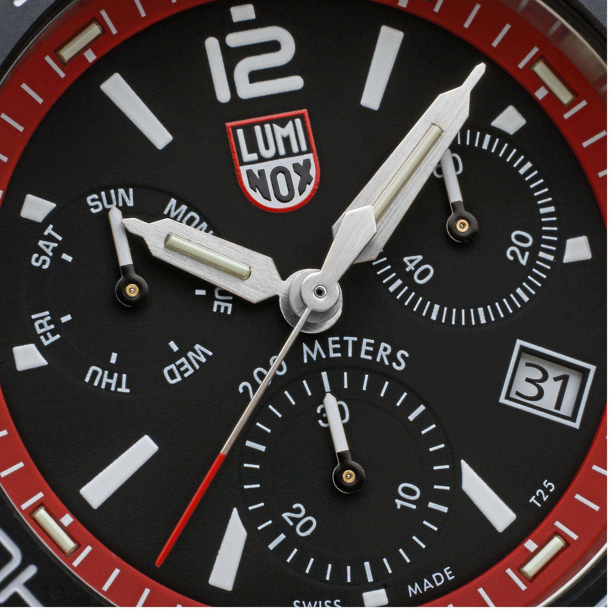 Diver chronograph watch dial close-up with luminous markers, subdials, and date window.