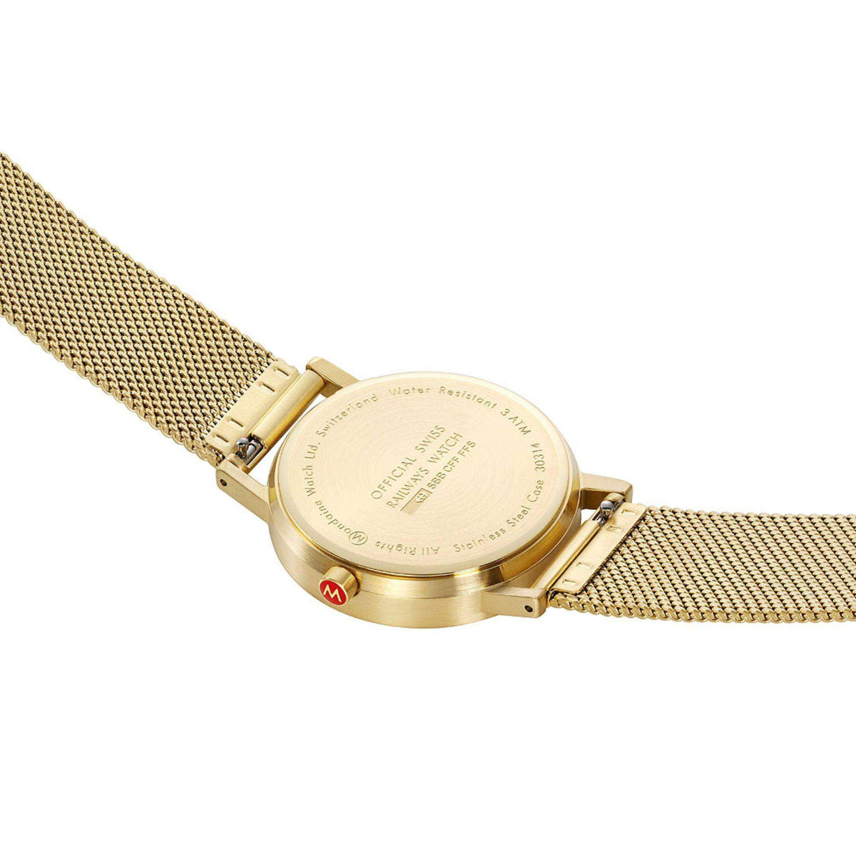 Gold watch caseback with engraved text and gold mesh strap