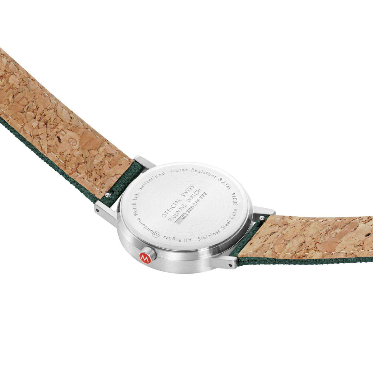 Back of forest green dial watch with metal case and tan cork-texture strap underside